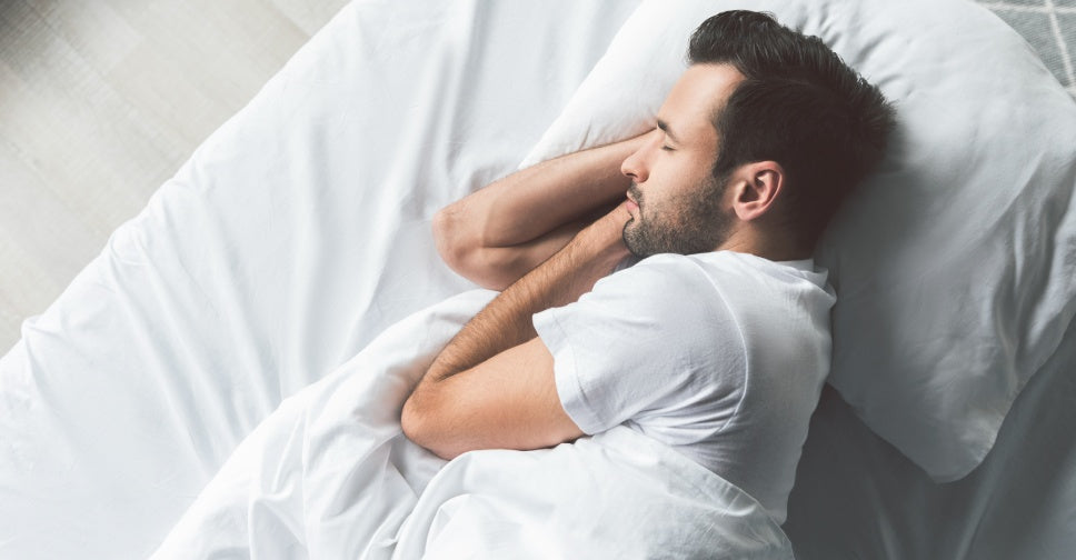 man sleeping on cruise bed